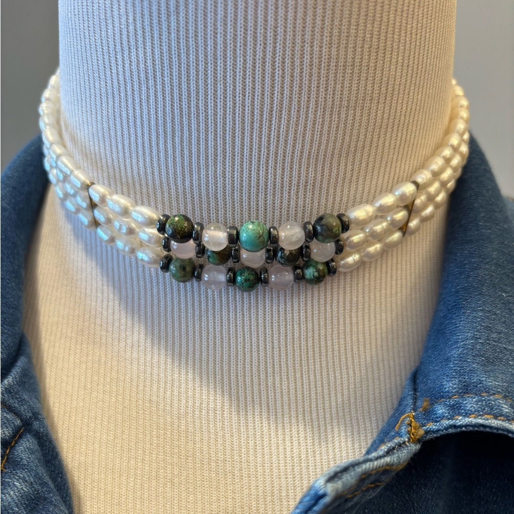 Triple strand fresh water pearl choker. Measures 16 1/8 inches in length.